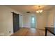 Bright dining room with hardwood floors and barn door at 607 S Georgia St, Sheridan, IN 46069