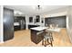 Modern kitchen with dark cabinetry, stainless steel appliances, and a large island at 6919 Wilmot Ln, Avon, IN 46123