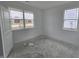 Well-lit bedroom with two windows and neutral walls at 8822 Walker St, Fortville, IN 46040