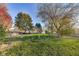 Fenced backyard with garden, shed, and mature trees at 534 Austrian Way, Avon, IN 46123