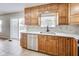 Modern kitchen with wood cabinets, stainless steel appliances, and a backyard view at 534 Austrian Way, Avon, IN 46123