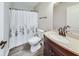 Clean bathroom with dark vanity, shower, and white toilet at 534 Austrian Way, Avon, IN 46123