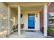 Inviting front porch with a blue door and wooden swing at 534 Austrian Way, Avon, IN 46123