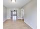 Dining room with light gray walls, wood floors, and views into other rooms at 534 Austrian Way, Avon, IN 46123