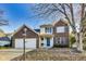 Two-story brick home with a two-car garage and blue door at 534 Austrian Way, Avon, IN 46123