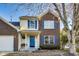 Two-story brick home with blue shutters and a porch at 534 Austrian Way, Avon, IN 46123