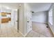 Hallway with light tile flooring, offering views into the living room and kitchen at 534 Austrian Way, Avon, IN 46123