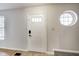 Bright entryway with a white door and circular window at 534 Austrian Way, Avon, IN 46123