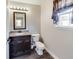 Well-lit bathroom with dark vanity and window at 534 Austrian Way, Avon, IN 46123