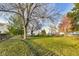Spacious backyard with mature trees and a grassy lawn at 534 Austrian Way, Avon, IN 46123