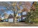 Brick two-story house with attached garage, mature tree, and landscaping at 534 Austrian Way, Avon, IN 46123