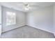 Simple bedroom with gray carpet and a large window at 534 Austrian Way, Avon, IN 46123