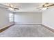 Bonus room with hardwood floors, ceiling fans, and large window at 534 Austrian Way, Avon, IN 46123