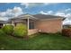 Brick ranch home with covered patio, landscaped yard, and mature shrubs at 3723 Mansfield Dr, Brownsburg, IN 46112