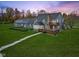 House with detached garage and large backyard at dusk at 5911 N 400 W, Bargersville, IN 46106