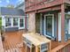 Spacious deck with a wooden table and chairs, overlooking a grassy backyard at 5911 N 400 W, Bargersville, IN 46106