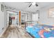 bedroom with mirrored closet doors and gaming decor at 5911 N 400 W, Bargersville, IN 46106