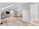 Spacious bonus room with a comfy couch and hardwood floors at 5911 N 400 W, Bargersville, IN 46106