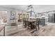 Eat-in kitchen with farmhouse table and chairs, leading to a sunroom at 5911 N 400 W, Bargersville, IN 46106