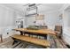 Rustic dining room with a wood table, bench seating, and a modern chandelier at 5911 N 400 W, Bargersville, IN 46106
