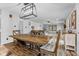 Farmhouse-style dining room with a large wooden table and bench at 5911 N 400 W, Bargersville, IN 46106
