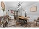Elegant dining room with a farmhouse table, wood floors, and a stylish chandelier at 5911 N 400 W, Bargersville, IN 46106