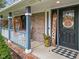 Front porch with black door and fall decor at 5911 N 400 W, Bargersville, IN 46106