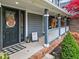 Front porch with black door and fall decor at 5911 N 400 W, Bargersville, IN 46106