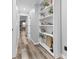 Hallway with built-in shelving and hardwood floors at 5911 N 400 W, Bargersville, IN 46106