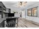 Bright home office features built-in shelving, hardwood floors, and a large window at 5911 N 400 W, Bargersville, IN 46106