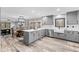 Spacious kitchen boasts a large island, farmhouse sink, and an open floor plan at 5911 N 400 W, Bargersville, IN 46106