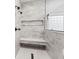 Large walk-in shower with marble tile, built-in seat, and rainfall shower head at 5911 N 400 W, Bargersville, IN 46106