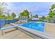 In-ground pool with diving board, spacious patio, and a storage shed at 2005 Deer Lake Dr, Martinsville, IN 46151