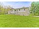 Ranch-style home with stone accents and a lush lawn at 2005 Deer Lake Dr, Martinsville, IN 46151