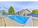 Large in-ground pool with diving board and spacious surrounding patio at 2005 Deer Lake Dr, Martinsville, IN 46151