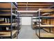 Unfinished basement with ample storage shelving at 2505 Riverside Dr, Columbus, IN 47201