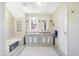 Bathroom with subway tile, double vanity, and classic white fixtures at 2505 Riverside Dr, Columbus, IN 47201