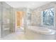 Large bathroom with a soaking tub, walk-in shower, and access to a closet at 2505 Riverside Dr, Columbus, IN 47201