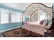 Charming bedroom with canopy bed, area rug, and built-in shelving at 2505 Riverside Dr, Columbus, IN 47201