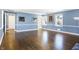 Spacious bedroom with hardwood floors, blue walls, and plenty of natural light at 2505 Riverside Dr, Columbus, IN 47201