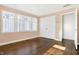 Simple bedroom with hardwood floors, neutral walls, and closet at 2505 Riverside Dr, Columbus, IN 47201