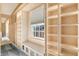Well-organized closet with custom shelving and drawers, and window at 2505 Riverside Dr, Columbus, IN 47201