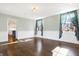 Spacious dining room with hardwood floors and view of kitchen at 2505 Riverside Dr, Columbus, IN 47201