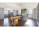 Bright home office featuring built-in shelving and hardwood floors at 2505 Riverside Dr, Columbus, IN 47201