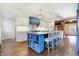 Island kitchen with blue cabinetry, granite countertops, and stainless steel appliances at 2505 Riverside Dr, Columbus, IN 47201