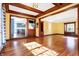 Bright living room with hardwood floors, built-in shelving, and large windows at 2505 Riverside Dr, Columbus, IN 47201