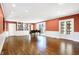 Large living room with hardwood floors, built-ins, and French doors at 2505 Riverside Dr, Columbus, IN 47201