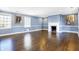 Spacious living room with hardwood floors, fireplace, and large windows at 2505 Riverside Dr, Columbus, IN 47201