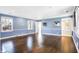 Bright living room with hardwood floors and access to a bathroom at 2505 Riverside Dr, Columbus, IN 47201