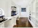 Home office with hardwood floors, built-in shelving and workspaces at 2505 Riverside Dr, Columbus, IN 47201